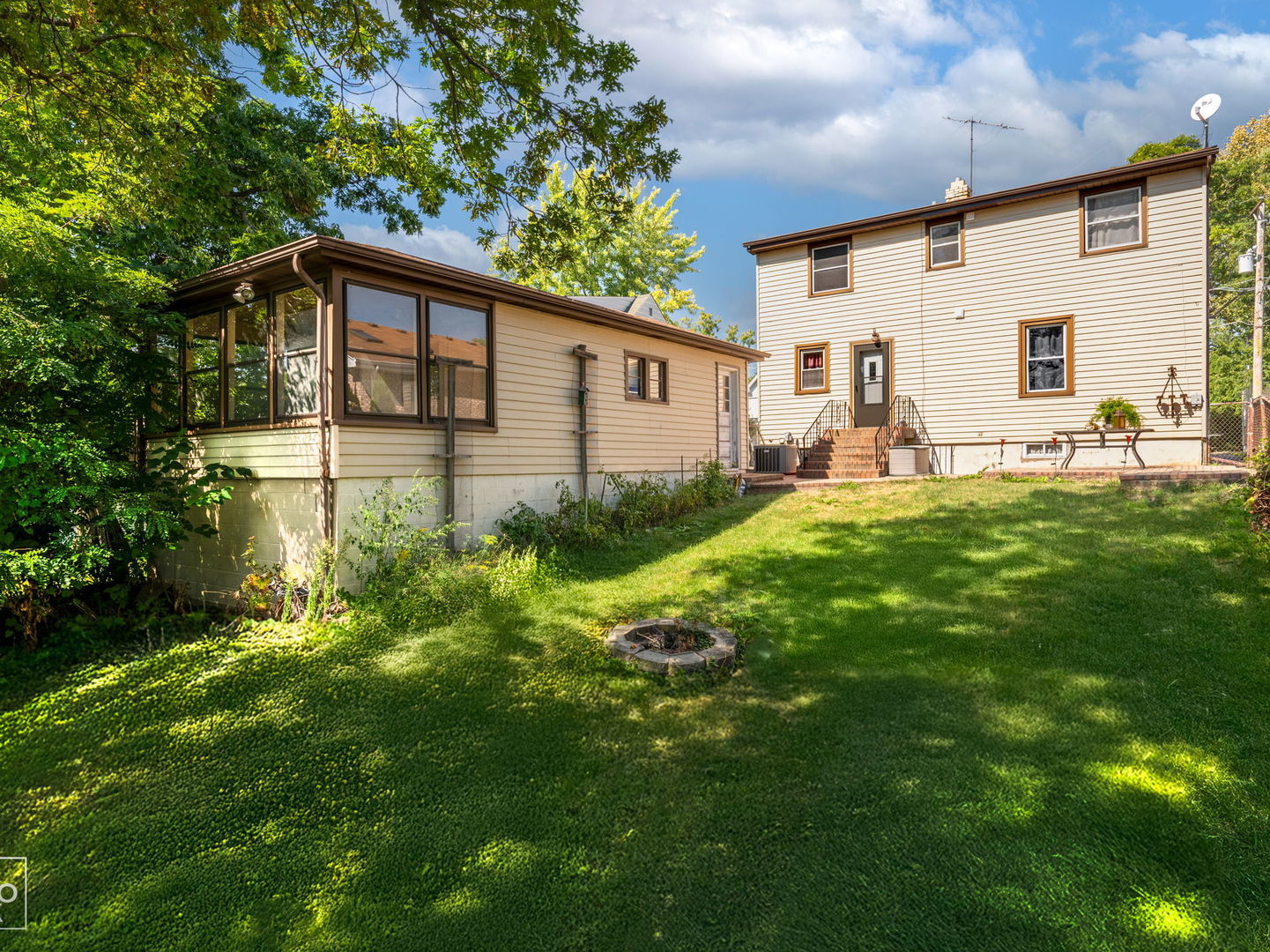 a backyard of a house with garden and patio