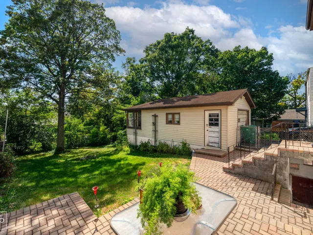 a view of backyard with a garden and plants
