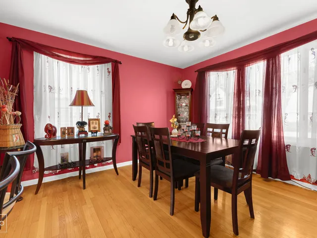 a view of a dining room with furniture and window