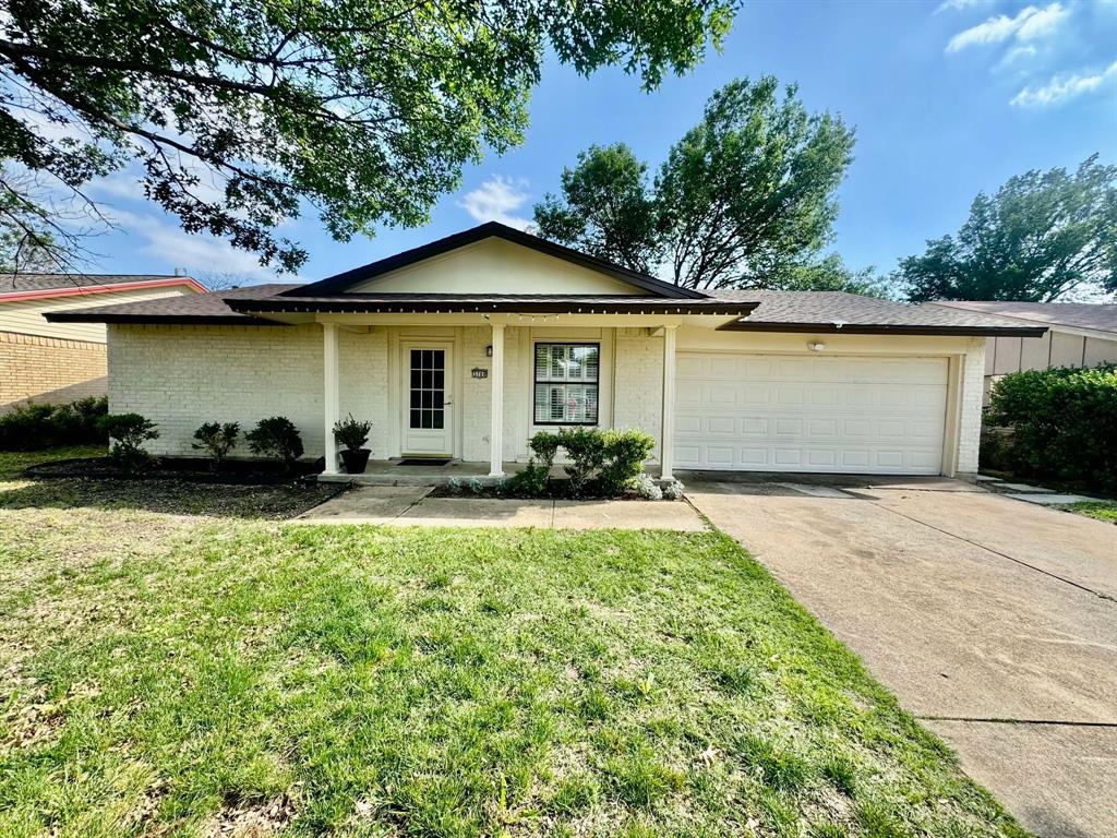 3700 Finley Road Irving, TX 75062 - Photo 1 of 1 a front view of a house with a garden