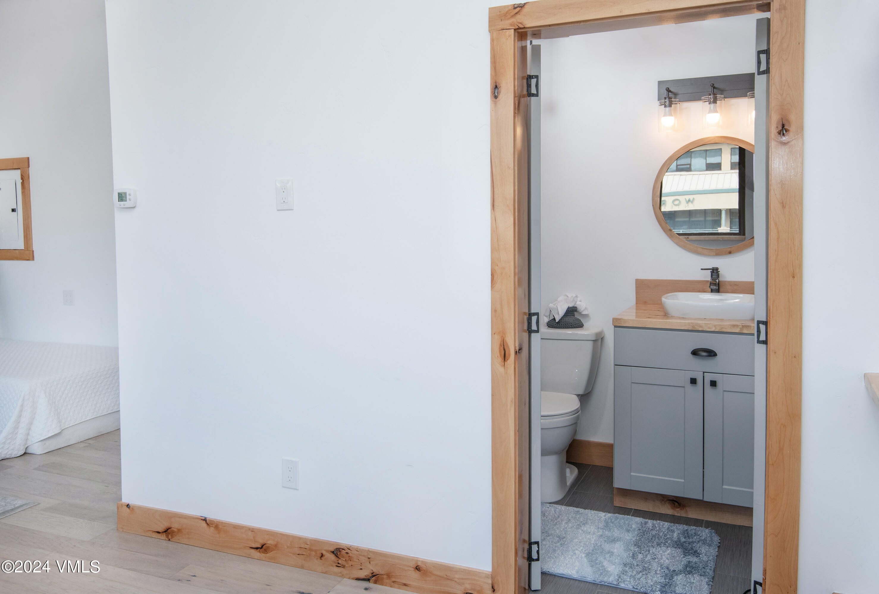 70 Benchmark Road, Unit 201 Avon, CO 81620 - Photo 11 of 32 a bathroom with a toilet and a mirror