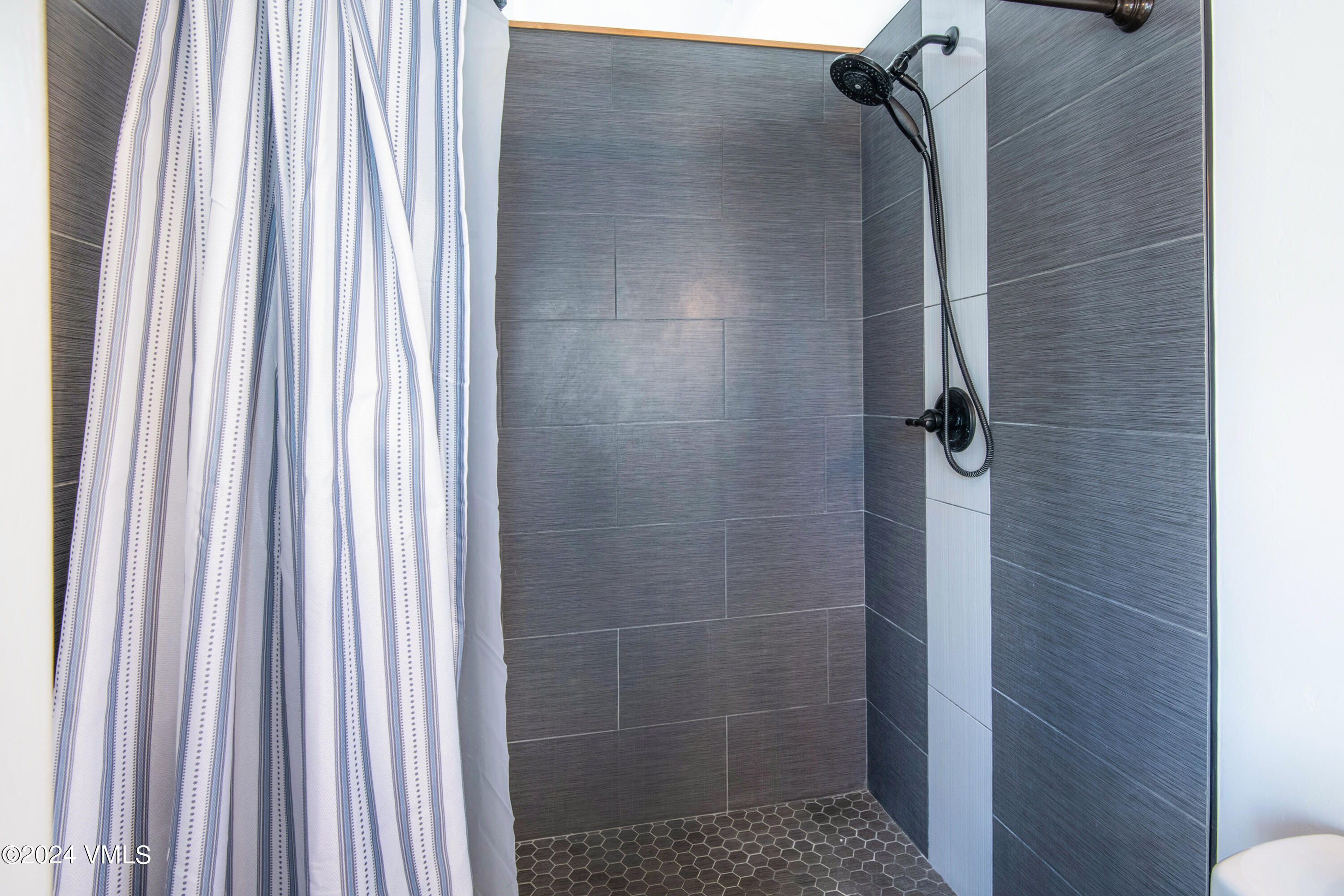 70 Benchmark Road, Unit 201 Avon, CO 81620 - Photo 13 of 32 a bathroom with a shower