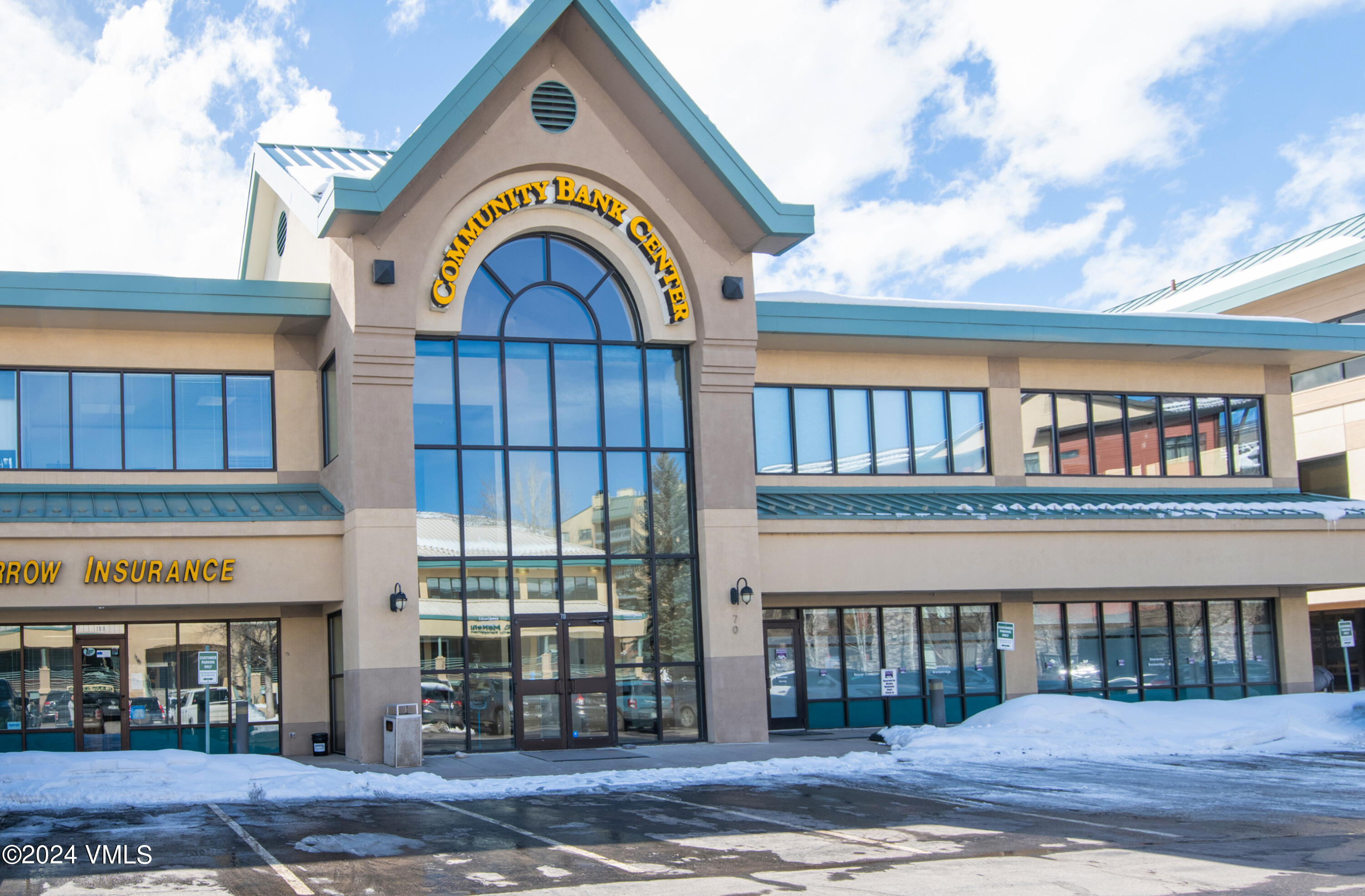 70 Benchmark Road, Unit 201 Avon, CO 81620 - Photo 16 of 32 a view of a brick building with a floor to ceiling window