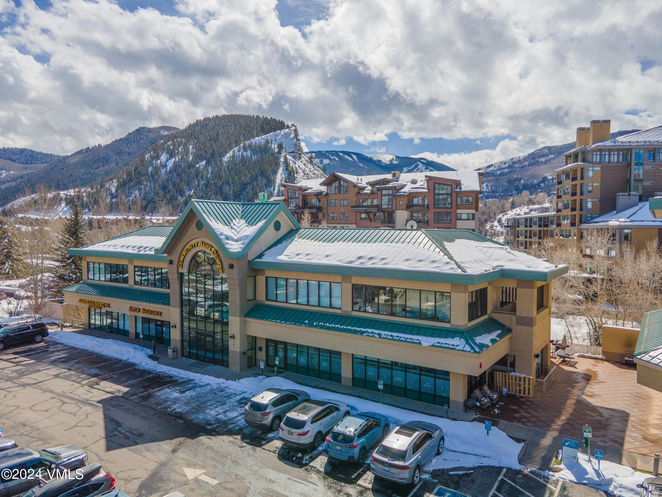 70 Benchmark Road, Unit 201 Avon, CO 81620 - Photo 17 of 32 a view of a big yard next to a large building