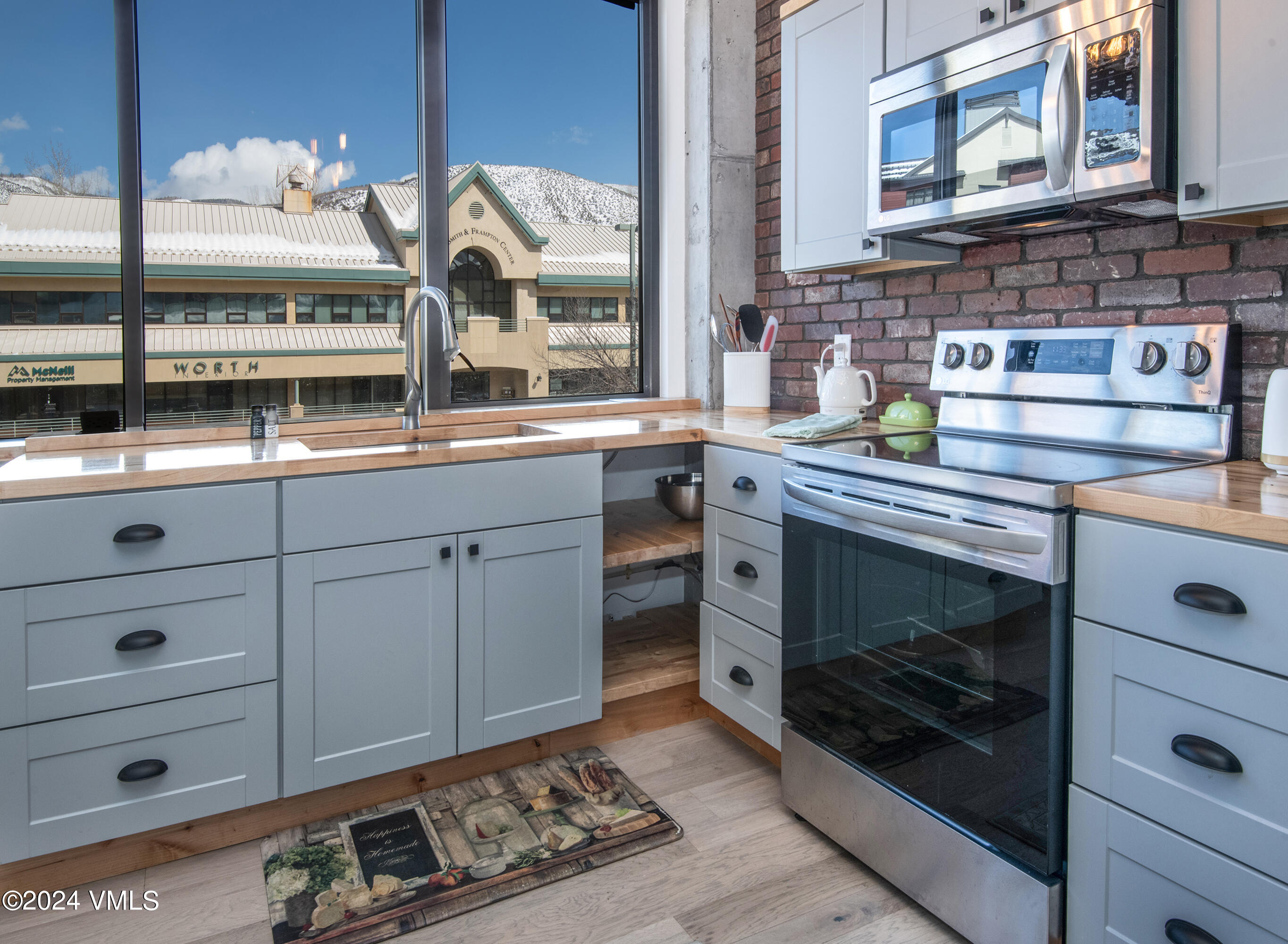 70 Benchmark Road, Unit 201 Avon, CO 81620 - Photo 9 of 32 a kitchen with a stove and a sink