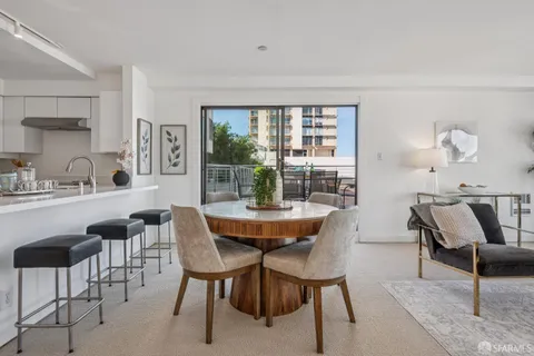 a kitchen with kitchen island granite countertop counter top space and stainless steel appliances