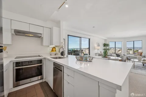 a kitchen with counter top space a sink and cabinets
