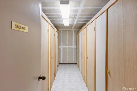 a view of a street with potted plants