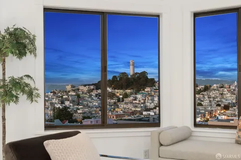 a view of a door and chair in the balcony