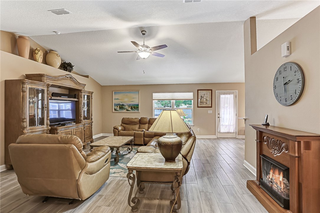 88381 Maybourne Road Yulee, FL 32097 - Photo 14 of 24 a living room with furniture and a large window