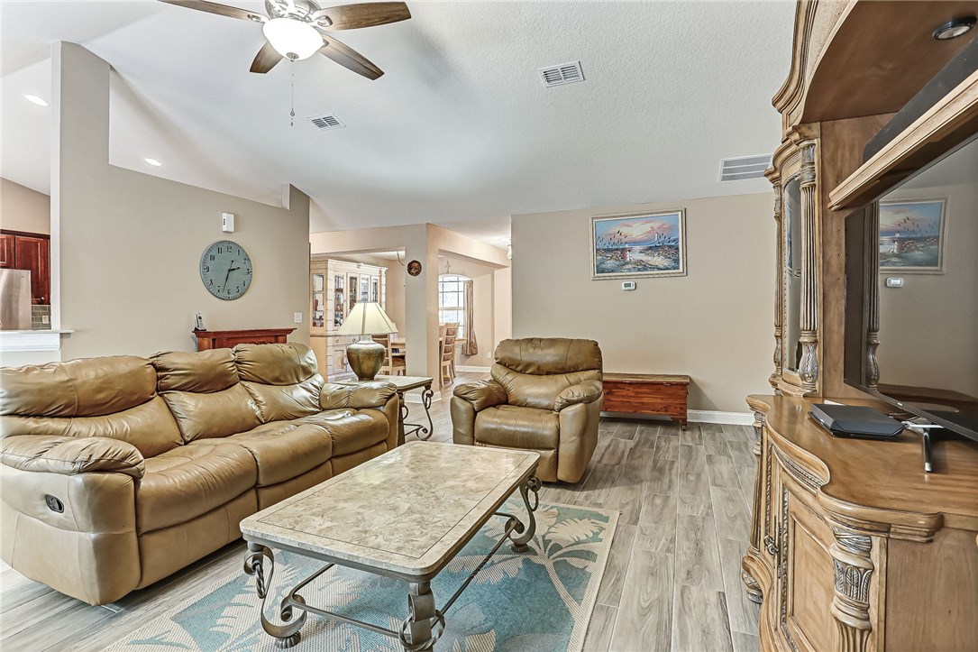 88381 Maybourne Road Yulee, FL 32097 - Photo 16 of 24 a living room with furniture and a flat screen tv