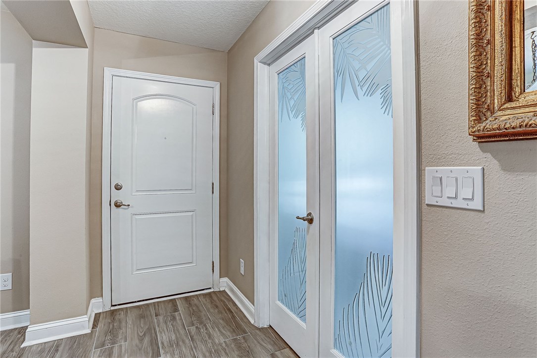 88381 Maybourne Road Yulee, FL 32097 - Photo 20 of 24 a view of a hallway with wooden floor and staircase