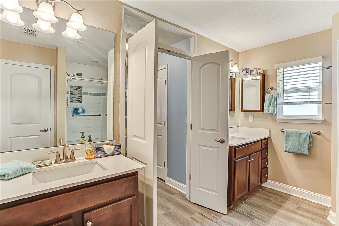 88381 Maybourne Road Yulee, FL 32097 - Photo 2 of 24 a bathroom with a sink double vanity and a mirror
