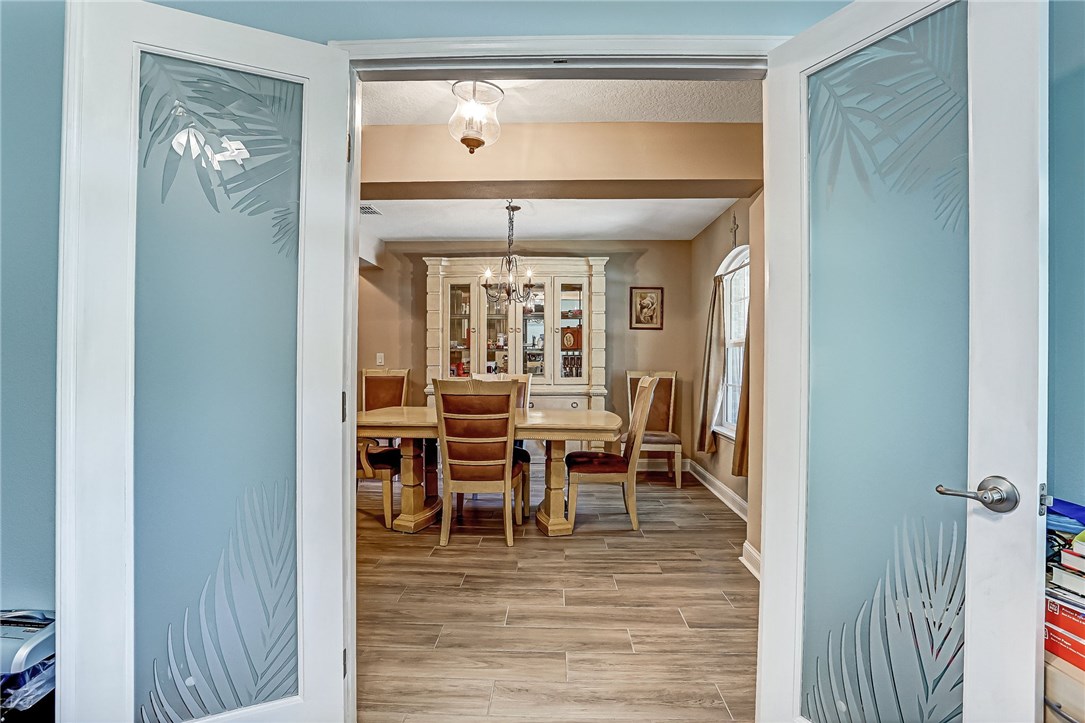 88381 Maybourne Road Yulee, FL 32097 - Photo 21 of 24 a view of a dining room with furniture window and wooden floor