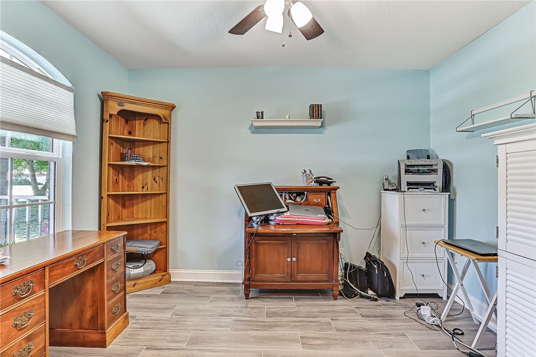 88381 Maybourne Road Yulee, FL 32097 - Photo 22 of 24 a view of a workspace with furniture and a window