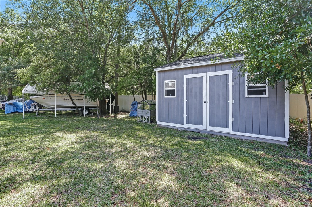 88381 Maybourne Road Yulee, FL 32097 - Photo 24 of 24 a view of a house with a yard