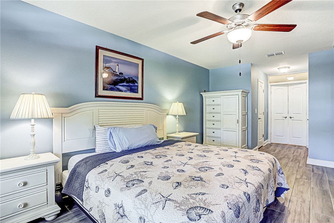 88381 Maybourne Road Yulee, FL 32097 - Photo 3 of 24 a bedroom with a bed and a chandelier