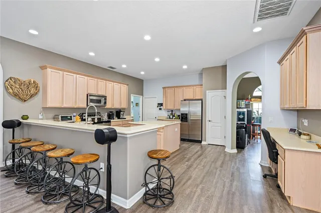 a view of cabinets with wooden floor cabinet and windows