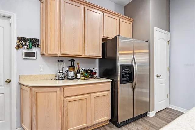 a kitchen with white cabinets sink and stainless steel appliances