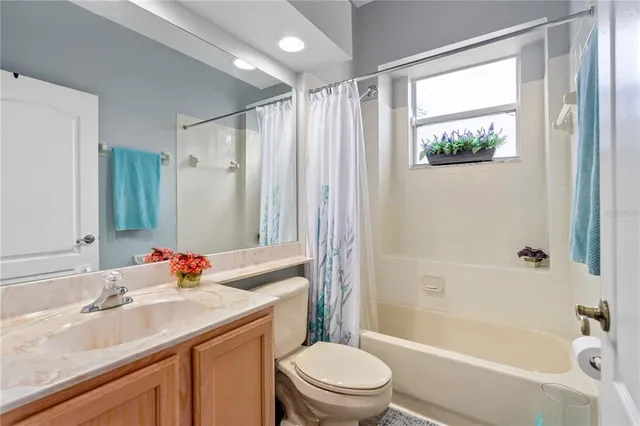 a bedroom with furniture and a flat screen tv