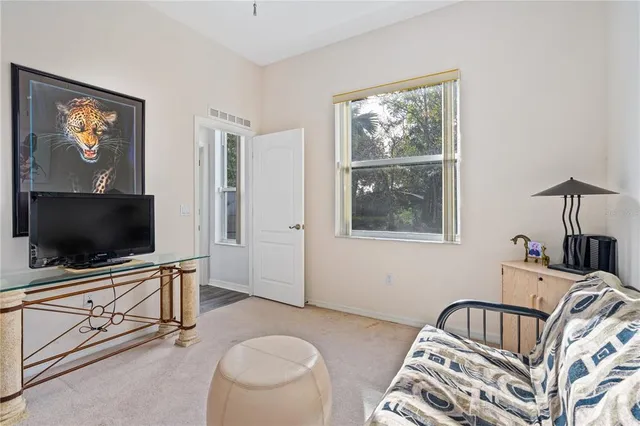 a white toilet sitting next to a bathroom sink and a shower