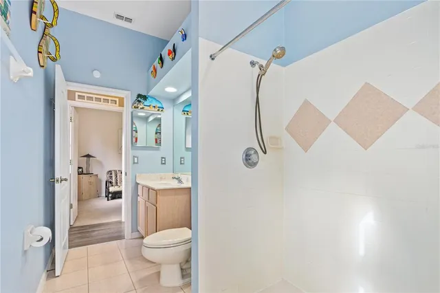 an aerial view of residential houses with outdoor space and swimming pool