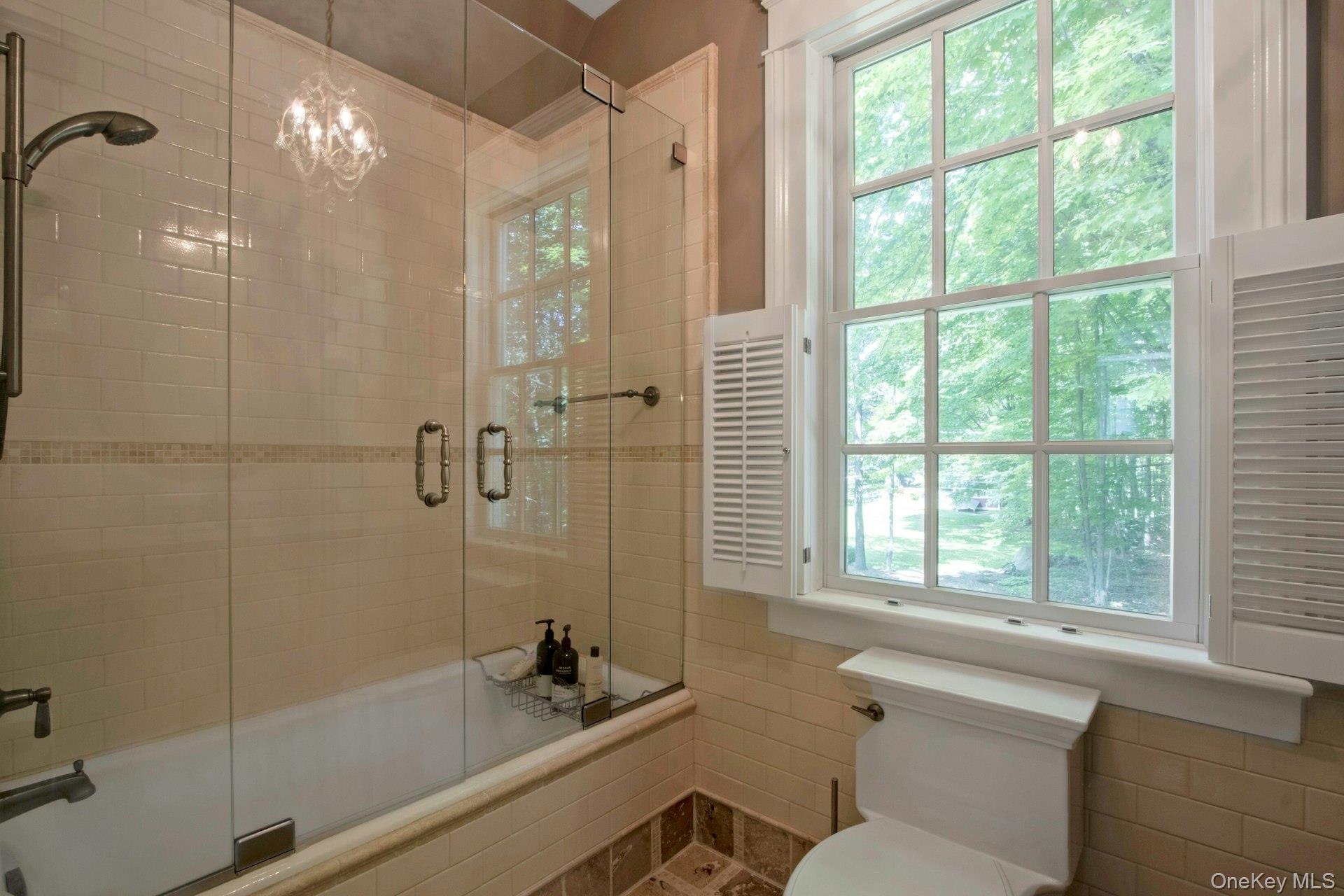314 Haverstraw Road Suffern, NY 10901 - Photo 26 of 44 a bathroom with a bathtub and a shower