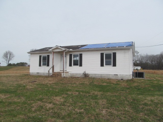 868 Barnette Road Minor Hill, TN 38473 - Photo 1 of 9 a view of a house with a backyard