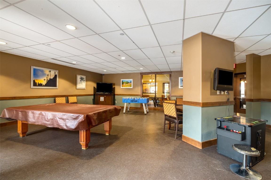 2796 Bronc Buster Loop Steamboat Springs, CO 80487 - Photo 12 of 15 a bedroom with furniture and a flat screen tv
