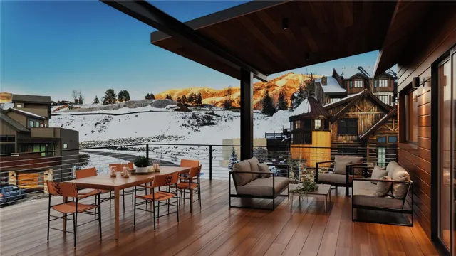 a view of a chairs and table in a patio