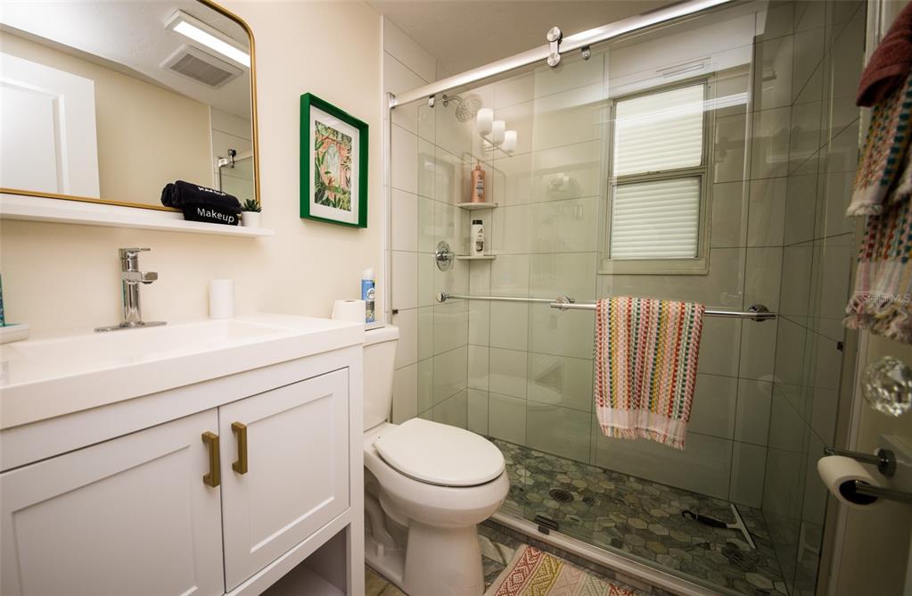 1805 Ivanhoe Street Sarasota, FL 34231 - Photo 11 of 34 a bathroom with a sink a toilet and shower
