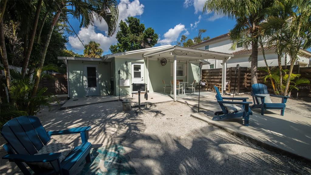 1805 Ivanhoe Street Sarasota, FL 34231 - Photo 15 of 34 a view of a house with backyard sitting area and garden