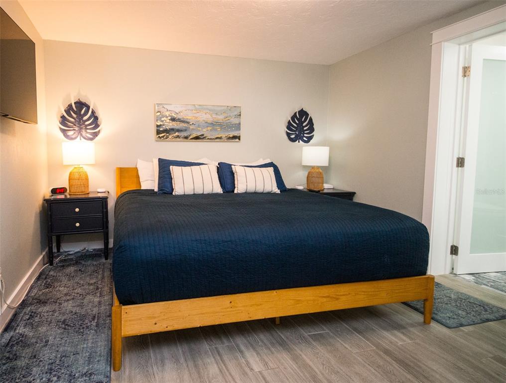 1805 Ivanhoe Street Sarasota, FL 34231 - Photo 24 of 34 a bedroom with a bed and a painting on the wall