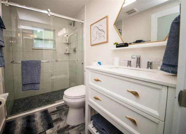 a bedroom with a bed and dresser