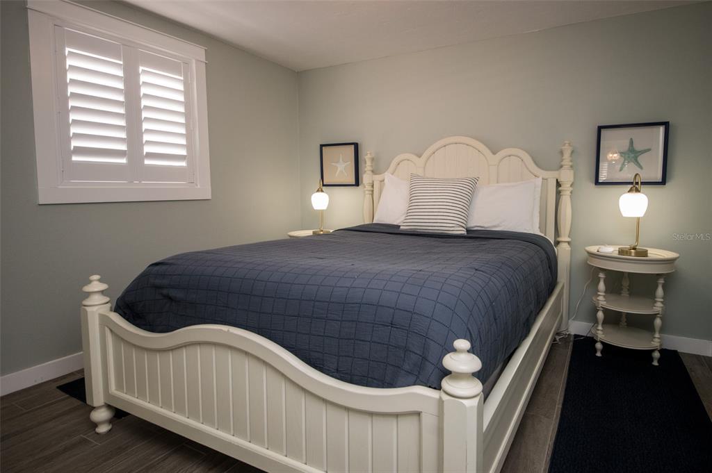 1805 Ivanhoe Street Sarasota, FL 34231 - Photo 26 of 34 a bedroom with a bed and dresser