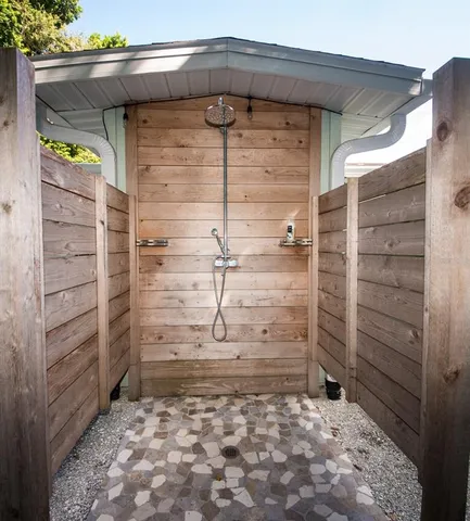 a view of a dining room and livingroom with furniture wooden floor and a rug