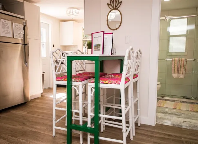 a living room with furniture a window and a potted plant