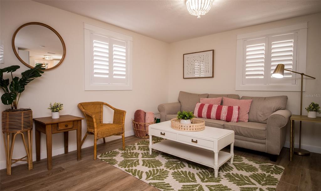 1805 Ivanhoe Street Sarasota, FL 34231 - Photo 10 of 34 a living room with furniture a window and a potted plant