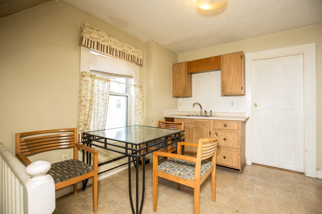 11 Phillips Avenue Lynn, MA 01902 - Photo 11 of 15 a view of a kitchen with a sink and cabinets