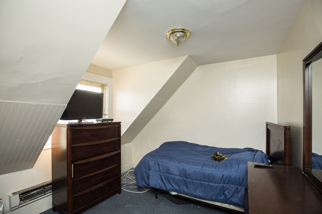 11 Phillips Avenue Lynn, MA 01902 - Photo 13 of 15 a living room with a bed furniture and a window