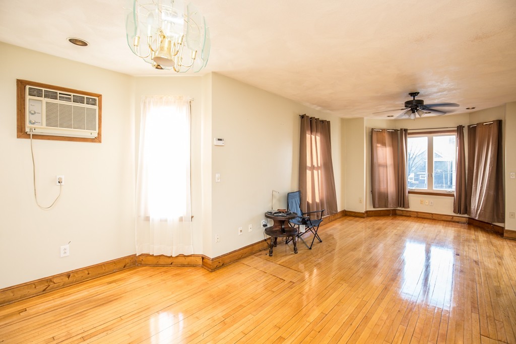 11 Phillips Avenue Lynn, MA 01902 - Photo 5 of 15 a view of a room with a window and wooden floor