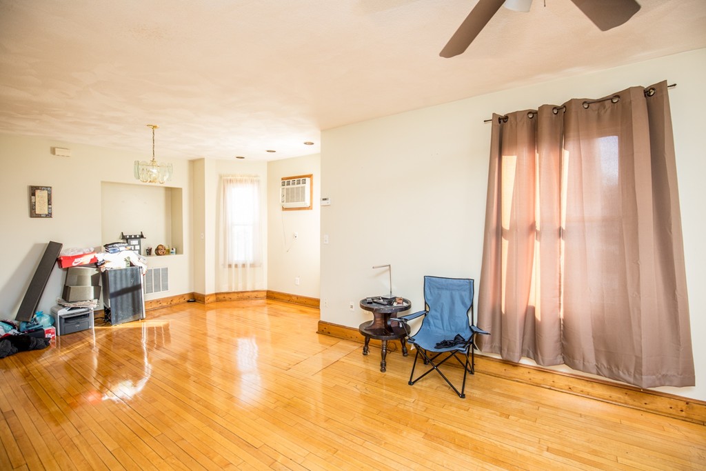 11 Phillips Avenue Lynn, MA 01902 - Photo 6 of 15 a living room with furniture and a wooden floor