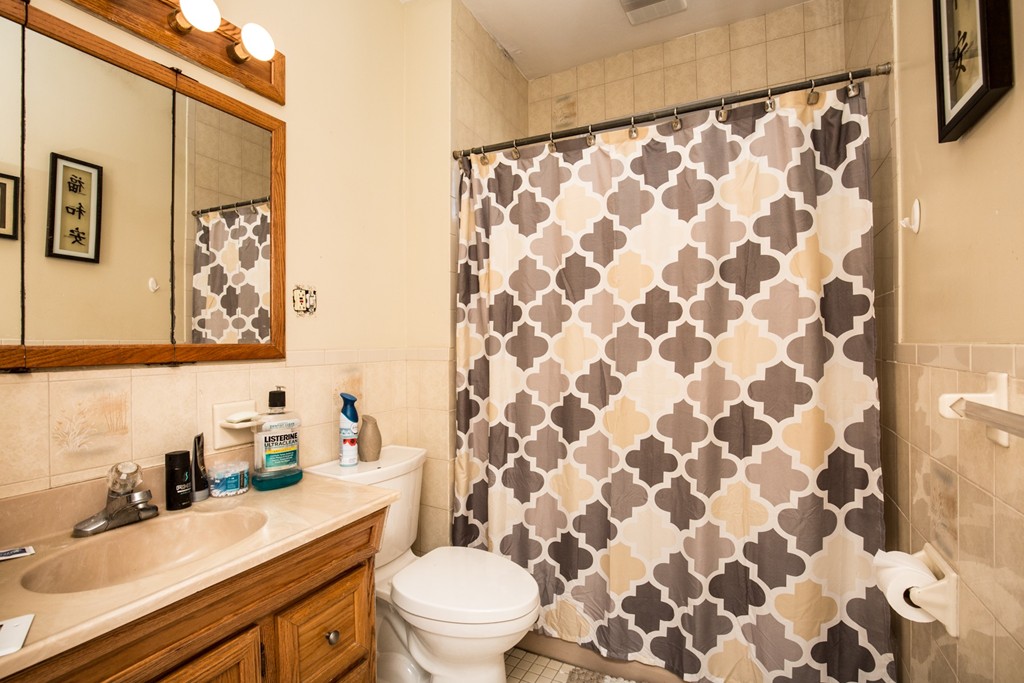 11 Phillips Avenue Lynn, MA 01902 - Photo 7 of 15 a bathroom with a sink toilet and shower