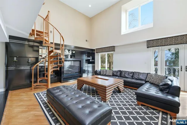 a living room with furniture a rug and a window