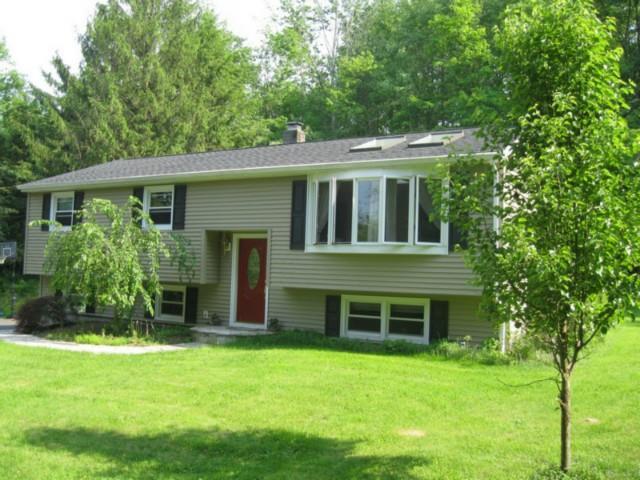 15 Scudder Road Newtown, CT 06470 - Photo 1 of 1 a front view of a house with a garden