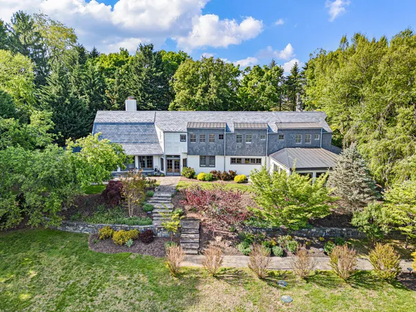 an aerial view of a house with a garden and plants