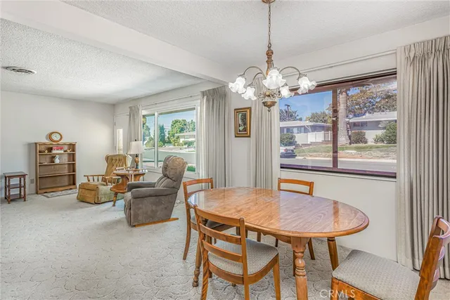 a view of a dining room with furniture window and outside view