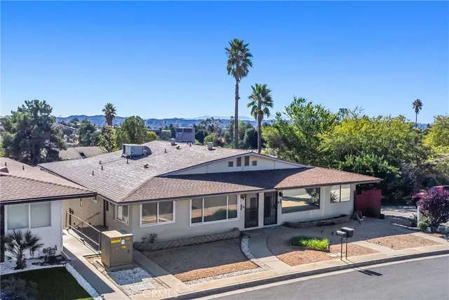 a aerial view of a house with a yard