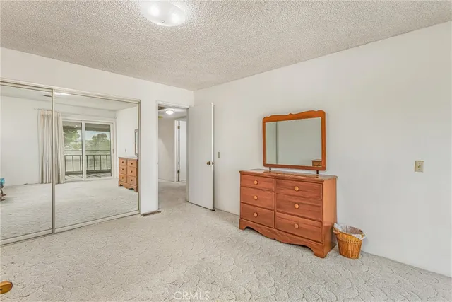 a room with a dresser and a mirror