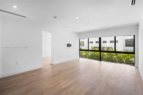 a view of an room with wooden floor